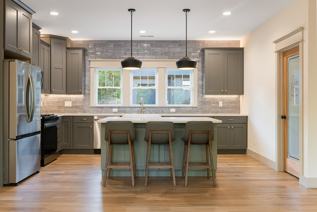 Custom kitchen with gray cabinetry and pendant lighting at 30 Acona Lane