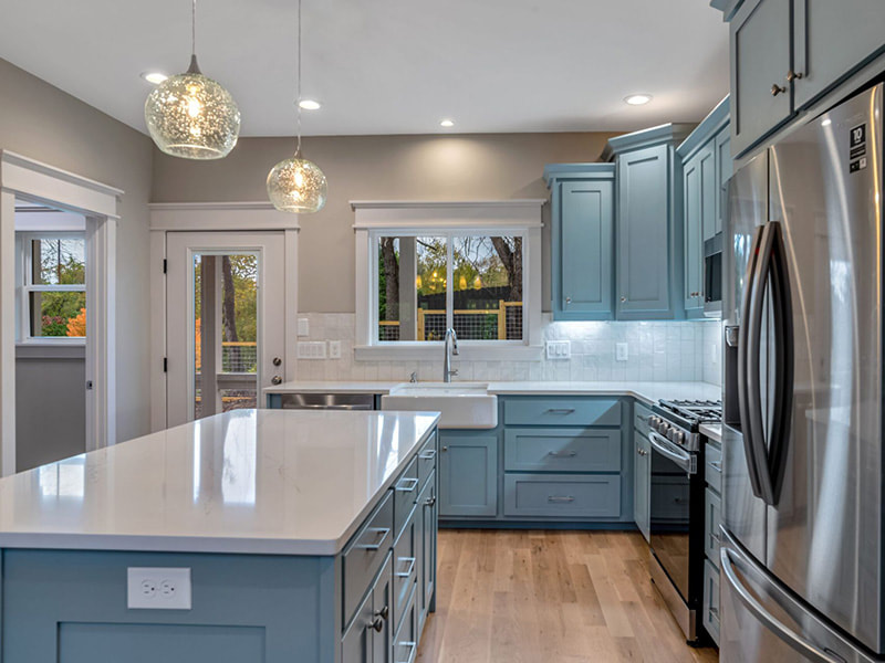 Blue-gray custom kitchen renovated by Wanoca Builders